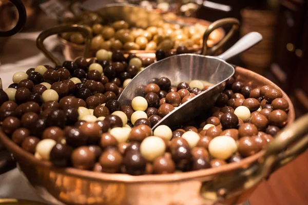 Belgium tasty truffle delicious chocolate in a row, candy shop view. Food travel tourism. — Stock Photo, Image