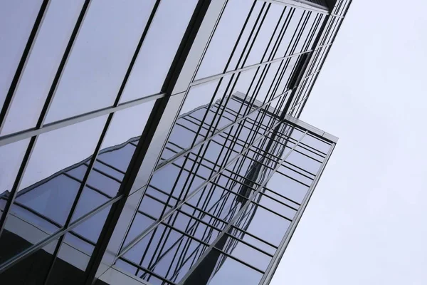 Abstract business modern city urban futuristic architecture background, motion blur, reflection in glass of high rise skyscraper facade, toned blue picture with bokeh. Real estate concept — Stock Photo, Image