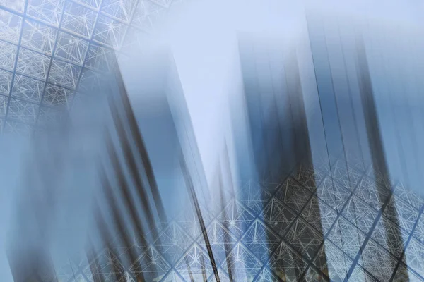 Abstract business modern city urban futuristic architecture background, motion blur, reflection in glass of high rise skyscraper facade, toned blue picture with bokeh. Real estate concept — Stock Photo, Image