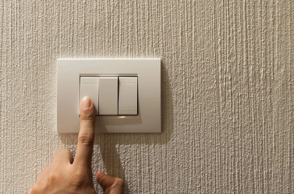 Closeup of A finger is turning on a lighting switch. — Stock Photo, Image