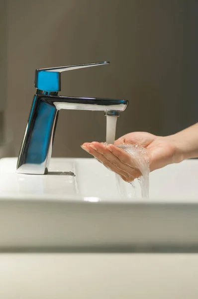 Close up of Hand with faucet and water flow. — Stock Photo, Image