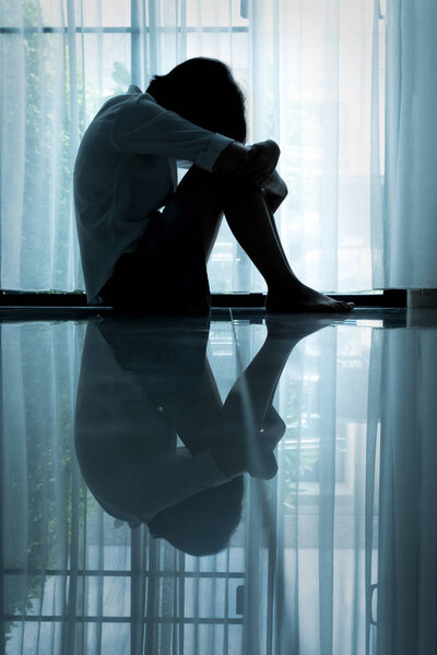 asian woman sitting in the house.