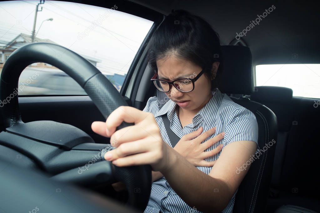Heart attack in a car. Stock Photo by ©eggeeggjiew 130193174
