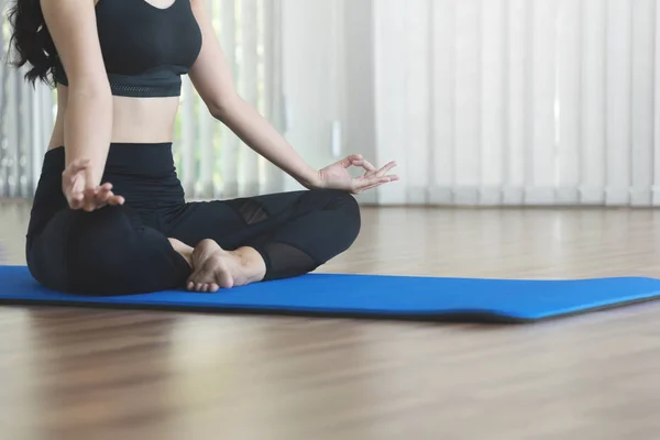 Young Asian woman practicing yoga. Girl is meditating. Copy spac — Stock Photo, Image