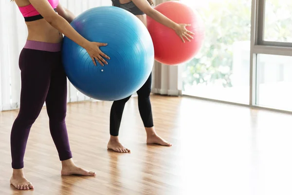 Group Asian People practicing yoga with yoga ball. Copy space. H