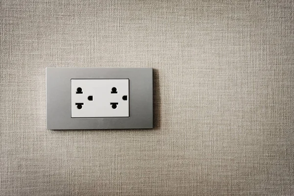 Close up grey plug on texture background. Copy space. — Stock Photo, Image