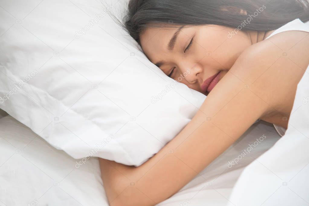Asian beautiful woman sleeping on her bed. 