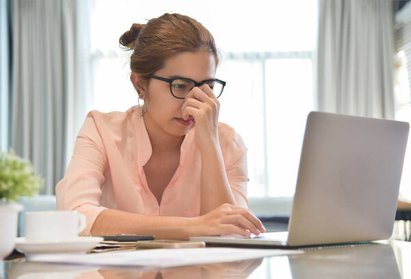 Female creative designer having headache.