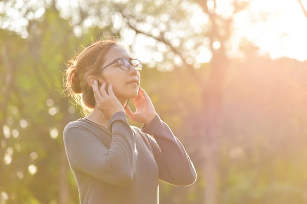 Asian woman is listening to the music.