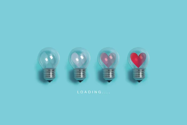 Red hearts in light bulbs. — Stock Photo, Image