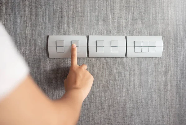 Asian Female Right Hand Turning Grey Light Switch Grey Texture — Stock Photo, Image