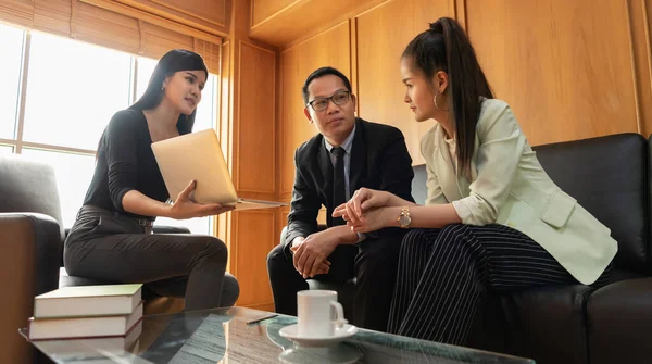 Business negotiation at the meeting. Businessman and Business women discussing, talking, consulting and brainstorming with partner and client at the office.