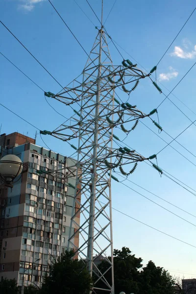 Electric towers with wires. Electric high voltage tower with electric line against clear blue sky