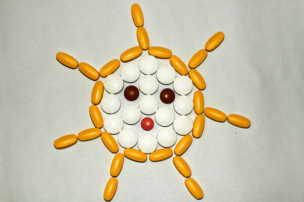 Tablets and capsules are lined in the form of the sun