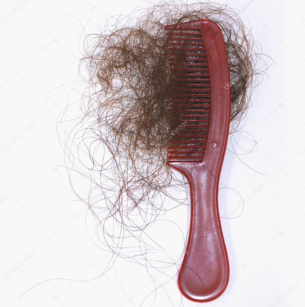 Hair loss. A lot of hair on a comb.