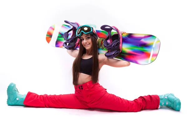 Красива дівчина зі сноубордом на вітринах робить шипи — стокове фото