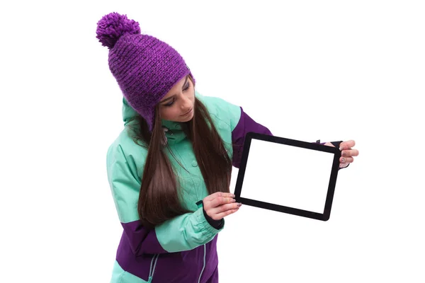 Snowboarder girl holding a tablet hands — Stock Photo, Image