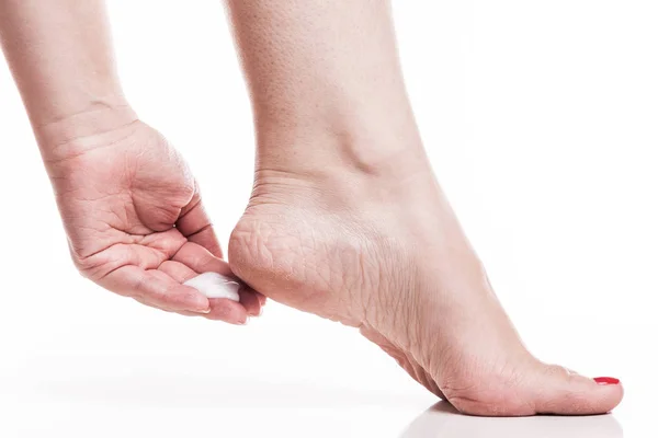 Woman applying heel cream for the skin — Stock Photo, Image