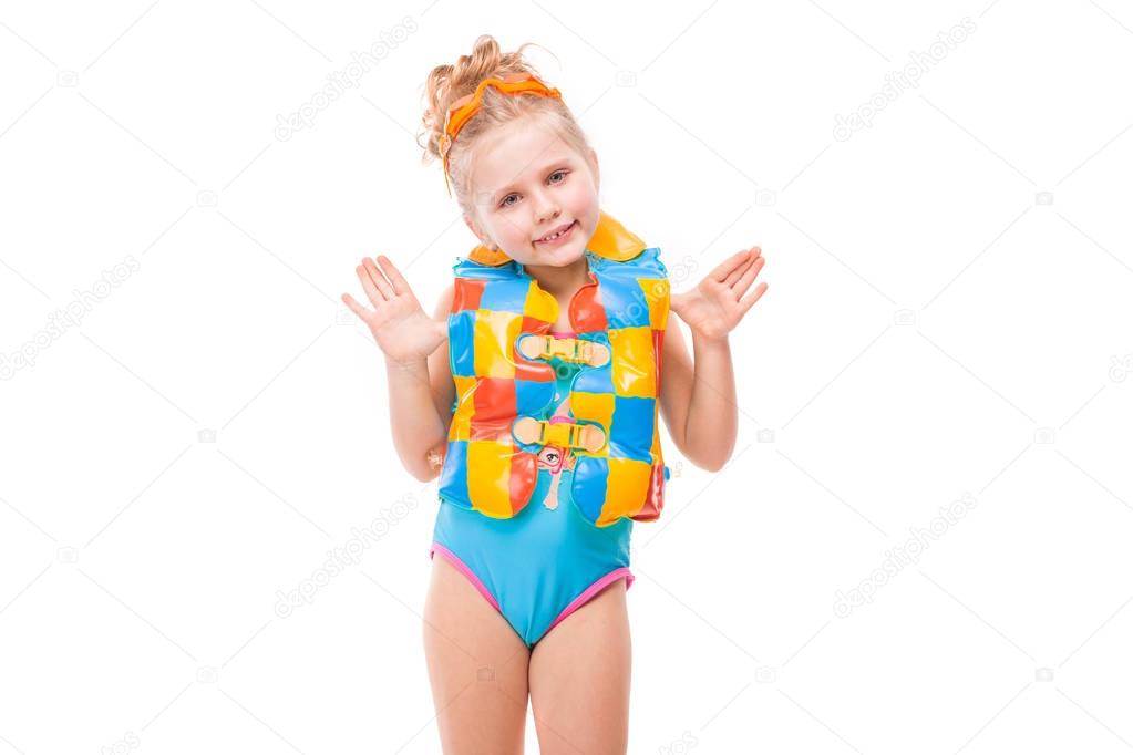 Girl in swimsuit and life jacket