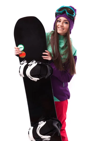 Красивая женщина в лыжном костюме с сноубордом — стоковое фото