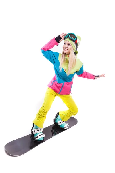 Mulher de terno de esqui passeios snowboard — Fotografia de Stock