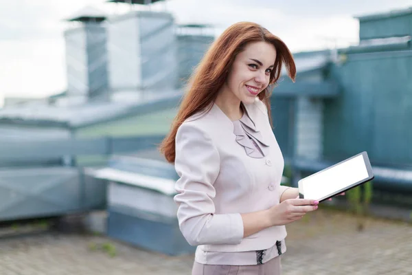 Business lady with tablet on roof