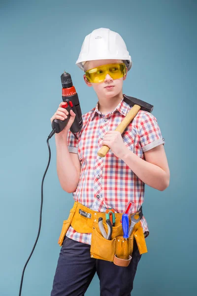 Boy in helmet holding instruments — Stock Photo, Image