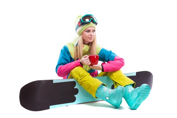 Женщина в лыжном костюме с сноубордом — стоковое фото