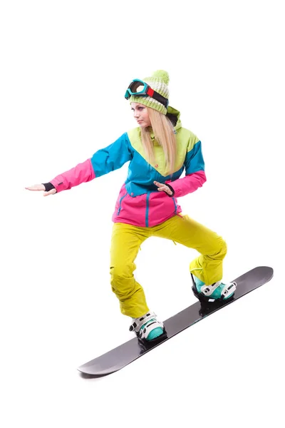 Femme en costume de ski monte snowboard — Photo