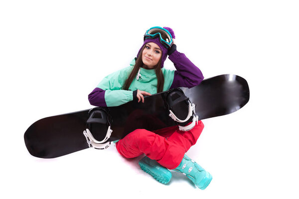 pretty woman in ski suit with snowboard
