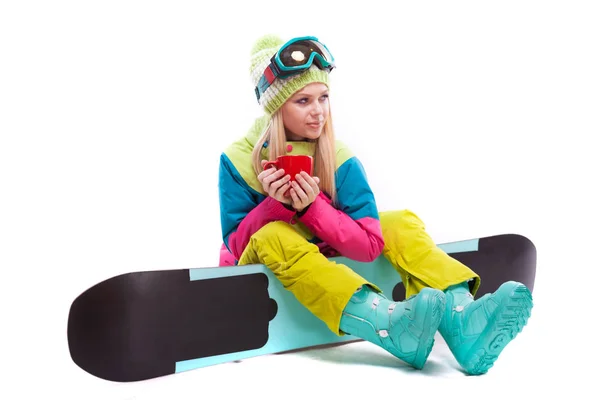 Femme en combinaison de ski avec snowboard — Photo