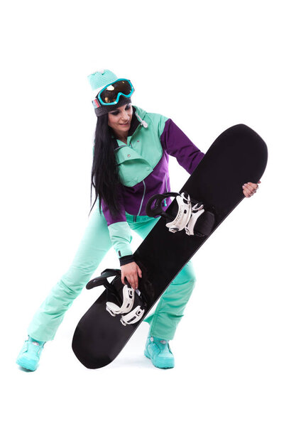 woman in purple ski costume with snowboard