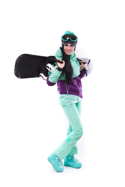 Женщина в фиолетовом лыжном костюме с сноубордом — стоковое фото
