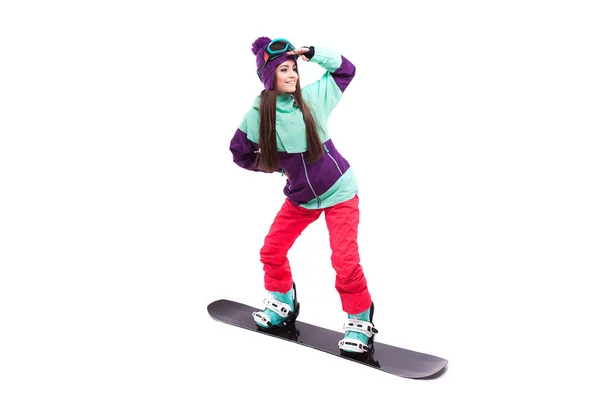 Γυναίκα με μωβ σκι βόλτες σνόουμπορντ — Φωτογραφία Αρχείου