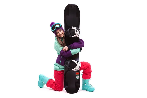 Jolie femme en costume de ski avec snowboard — Photo