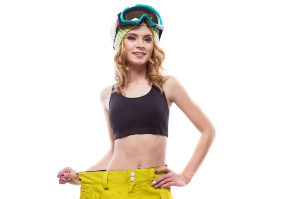 Jovem mulher em óculos de esqui e calças — Fotografia de Stock