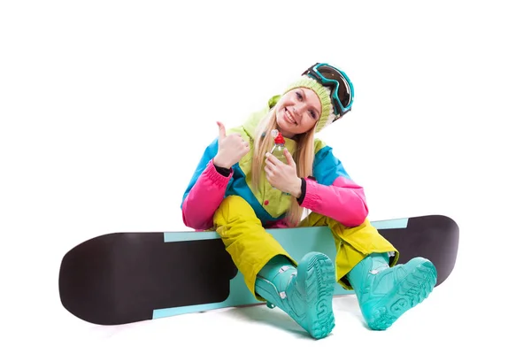 Жінка в лижному костюмі зі сноубордом — стокове фото