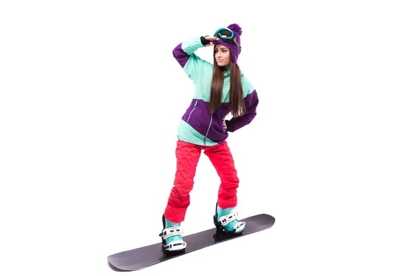 Mujer en paseos de esquí púrpura snowboard — Foto de Stock