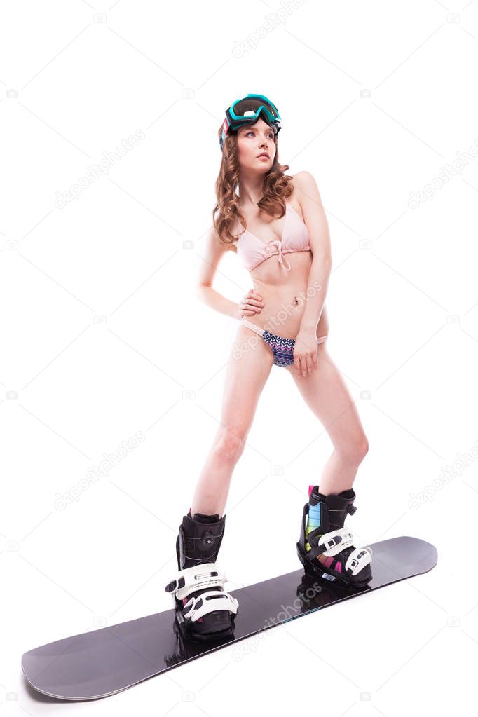 pretty sexy woman in bikini on snowboard