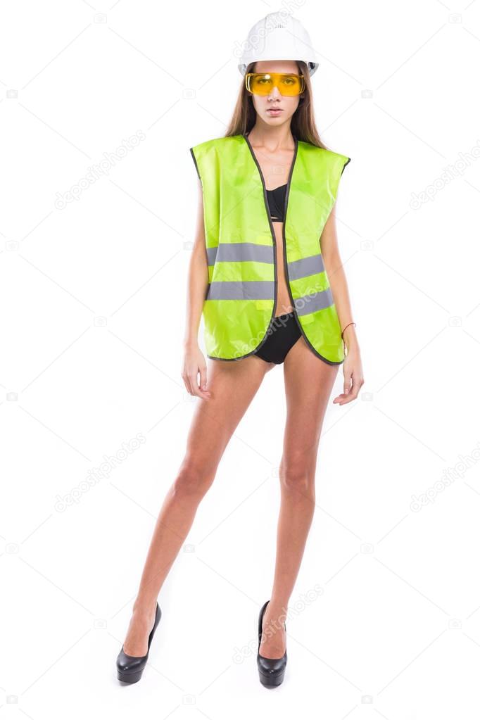 girl in yellow construction vest and helmet