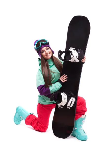 Гарна жінка в лижному костюмі зі сноубордом — стокове фото