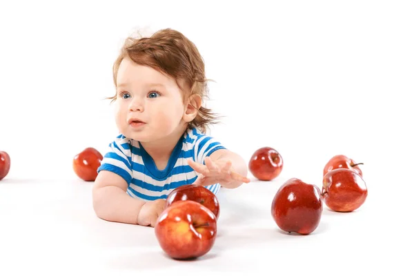 Smiling baby boy with apples — Stock Photo, Image