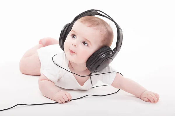 Lindo bebé niño en auriculares — Foto de Stock