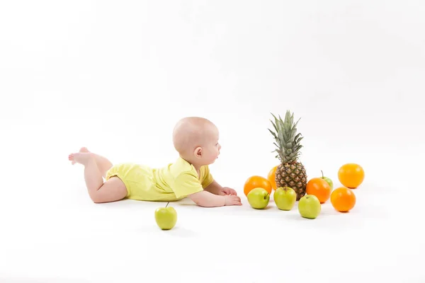 Smiling baby with fruits — Stock Photo, Image