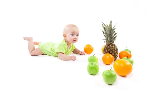 Smiling baby with fruits — Stock Photo, Image