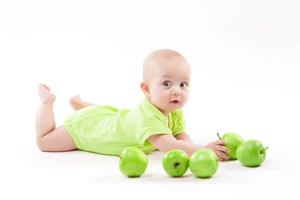 Smiling baby boy with apples — Stock Photo, Image