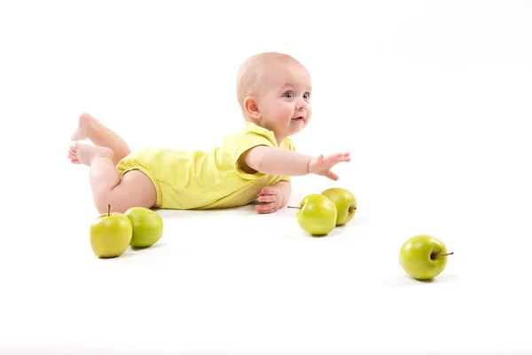 Smiling baby boy with apples — Stock Photo, Image