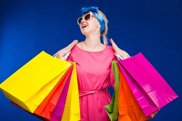 Blond girl with shopping bags — Stock Photo, Image