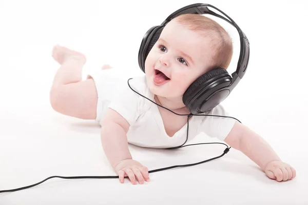Lindo bebé niño en auriculares — Foto de Stock
