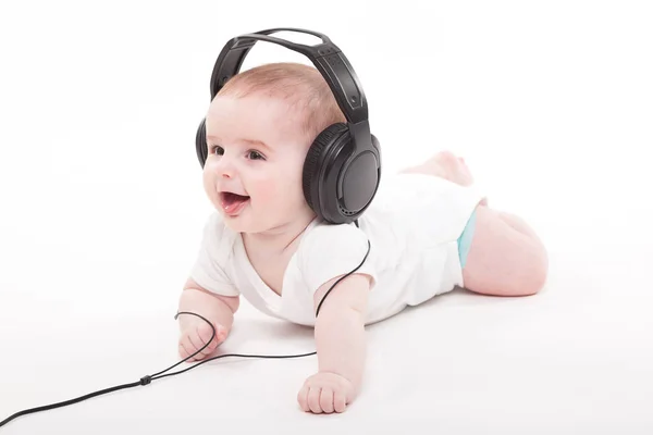 Lindo bebé niño en auriculares — Foto de Stock